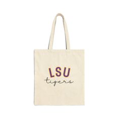 LSU Tigers Trendy Cotton Canvas Tote Bag! Cute tote bag for school use or groceries. Lovely gift for students who were just accepted, committing, and enrolling into the university for the LSU Tigers!  About the product: - 100% cotton bag - Size: 15" x 16"  - Durable and Reusable - 20" Handles - Heavy Fabric - Sewn-In Label Please read the following PRIOR to purchasing: - NO returns, refunds, or exchanges accepted. Please pre-measure to make sure it fits your laptop or other items you would like Casual Rectangular College Bag, Casual Rectangular College Bags, Casual College Rectangular Bag, School Canvas Bag With Letter Print, College School Spirit Bags For Back To School, Back To School Spirit College Bags, Back To School Canvas Bag With Letter Print, Back To School Bags With School Spirit, Casual College Bags For End Of School Year