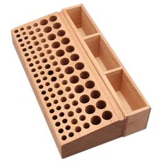 a wooden peg board with holes in it