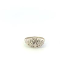 10K 1950's Oval Scalloped Ornate Statement Ring Size 5 White Gold *Weight: 2.4g *Composition: 10k GoldTested *Ring Size: 5 *Era: Vintage *Notes: There is a single stone missing from this ring Estimated Retail Replacement Value: $479.99 Please note: Unless otherwise noted, our items are solid gold (i.e. if it is listed as 14K Gold, it means it is solid 14K, not gold plated). Where applicable, all diamonds are graded according to GIA grading standards, the diamonds are NOT enhanced, unless noted. All gemstone weights are approximations based on measurements using industry accepted standards.   *GB000319* [CFXW] Classic Silver Dome Ring With Diamond Accents, Antique Oval Hallmarked Diamond Ring, Oval Art Deco Hallmarked Diamond Ring, Victorian Engraved Oval Diamond Ring, Vintage Engraved Dome Ring For Formal Occasions, Victorian Style Engraved Oval Diamond Ring, Victorian Oval Engraved Diamond Ring, Antique Oval White Gold Rings, Victorian Oval Engraved White Gold Ring