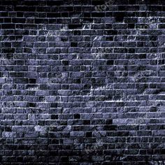 an old brick wall is shown in black and grey tones with some light spots on it