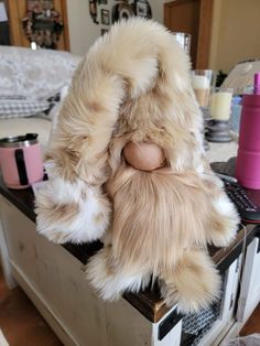 a stuffed animal sitting on top of a table