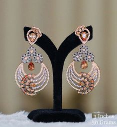 Lovely handcrafted gold silver oxidized chandbali earrings jewellery. Traditional Indian ethnic wear earrings studded with Ruby,Topaz stones and Clear crystals. This flowery designed jewellery can be used on marriage, engagement, birthday and any occasion. Trendy Bollywood chandelier Earrings make a beautiful gift for your wife, sister, mother and friend. Earrings Length: 3 inches Festive Silver Jhumkas With Elegant Design, Chandbali Chandelier Earrings With Intricate Design For Reception, Bollywood Earrings With Intricate Design For Reception, Bollywood Style Earrings With Intricate Design For Reception, Festive Bridal Chandbali Earrings With Elegant Design, Bollywood Style Intricate Earrings For Reception, Fusion Style Bridal Drop Earrings With Stone Work, Chandbali Chandelier Earrings For Diwali Reception, Fusion Style Chandbali Bridal Earrings