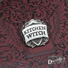 a close up of a book with a badge on it's cover that says witch