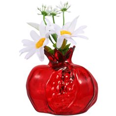 a red vase with white flowers in it