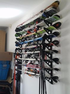 there is a rack with many skis on it