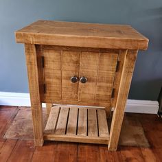 a wooden side table with two drawers