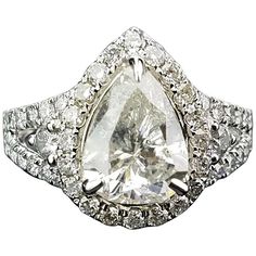 Statement pear shape diamond ring, with half moon side stones. Diamond Details: Cut: Pear shape Carat Weight: 2.18 carat Quality: I Cut: Half moon Carat Weight: 0.12 carat Quality: SI/I Cut: Brilliant (round) Carat Weight/l 0.70 Quality: SI/I 18K Gold: 4.89 grams Can provide certificate upon request. Can change ring size upon request. Can provide cleaning/re-polish service before shipping, upon request. Gia Certified Platinum Pear-shaped Diamond Ring, Gia Certified Teardrop White Ring, Gia Certified Teardrop Diamond Ring For Formal Occasions, Formal Gia Certified Teardrop Diamond Ring, Gia Certified Pear-shaped Diamond Ring, Gia Certified Teardrop Diamond Ring For Anniversary, Gia Certified Teardrop Diamond Ring Fine Jewelry, Gia Certified Teardrop Diamond Ring In Fine Jewelry Style, Elegant Gia Certified Teardrop Diamond Ring