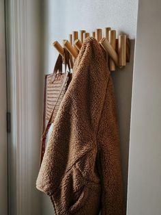 a coat rack with clothes hanging on it