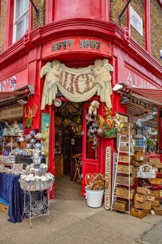 a red store front with lots of items on display