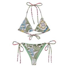 William Morris print all-over print recycled string bikini. Stay comfortable and stylish all summer with this All-Over Print Recycled String Bikini set. It's made from soft recycled polyester with double-layering and UPF 50+. Style the straps how you like and get ready to swim!  * Soft and stretchy material with UPF 50+ * Sizes up to 6XL * Bikini top comes with removable padding for comfort * Multiple ways to tie and style the bikini set Disclaimers:  * Due to the 2-layered construction and internal stitching, a visible stitch may appear in the crotch seam of the bikini bottom. This is a normal part of the manufacturing process and does not impact the quality or performance of the product. * To make your All-Over Print Recycled String Bikini last longer, thoroughly rinse it off after each Bohemian Green Tie-side Swimwear Bottom, Festival Green Printed Swimwear, Bohemian Printed Triangle Top Swimwear, Adjustable Floral Print Swimwear For Beach, Bohemian Green Swimwear With Tropical Print, Bohemian Green Tropical Print Swimwear, Green Bohemian Triangle Top Swimwear, Bohemian Adjustable Swimwear For Poolside, Green Tie-side Swimwear For Festivals