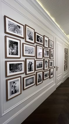 a long hallway with pictures on the wall