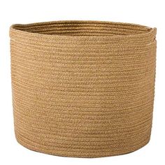 the large round basket is made out of jute and has two handles on each side