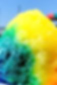 a blurry image of a rainbow colored bird