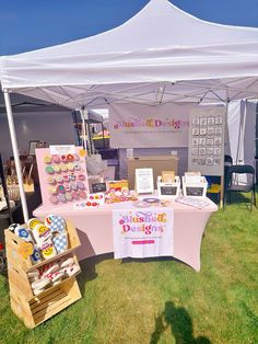 a tent set up with various items for sale