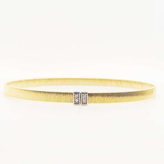 This 14 karat yellow gold satin cuff bangle bracelet is flexible and easy to put on and secure once you get it on! This bracelet is a very modern, design that touts quality and an eye for style. There is a white gold, rectangle that has a total of four diamonds that are VS1 clarity, and D-E color and all are round brilliant cut. 14 Karat Yellow Gold0.04 Carats Total Diamond Weight3.9 mm Wide6.70 Grams This bracelet is made to order and takes 2 to 4 weeks to create. Elegant Gold Band Cuff Bracelet, Modern Yellow Gold Bangle Diamond Bracelet, Elegant Yellow Gold Band Bracelets, Modern Diamond Bangle Bracelet, Modern Bracelets For Anniversary, Modern Flexible Bracelets For Anniversary, Modern Single Cut Diamond Cuff Bracelet, Modern Diamond Bangle Bracelet With Bracelet Strap, Elegant Rectangular Cuff Bracelet