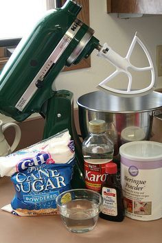 the ingredients are being prepared for baking on the counter top in front of an electric mixer