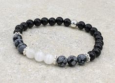 "This stretch bracelet is made with your choice of either 6mm or 8mm Black Obsidian, Snowflake Obsidian and Selenite gemstone beads.  It is accented with a round silver plate bead and spacer beads. These gemstones are known for providing protection against and removal of negative energy.   It is perfect for empaths and anyone dealing with negativity or anxiety.  Empaths are highly sensitive people who can easily feel the energy of others.  Black Obsidian is considered to be one of the most effec Selenite Jewelry, Black Obsidian Bracelet, Obsidian Bracelet