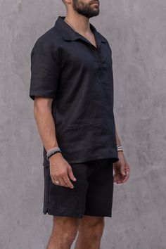 The Tulum Essentials Polo in black is a minimalist and elegant piece made from high-quality Belgian linen. It has a classic collar and short sleeves, with no buttons for a clean look. The breathable and moisture-wicking fabric is perfect for warm weather, and its hypoallergenic and bacteria-resistant properties make it ideal for sensitive skin. This versatile and timeless polo is a must-have for any wardrobe. Size: ONESIZE (M/L)Model: 180cmColor: BLACKMaterial: 100% PREMIUM LINEN Black Linen Short Sleeve Tops, Modern Black Linen Tops, Belgian Linen, Casual Elegance, Fashion Addict, Moisture Wicking Fabric, Tulum, Warm Weather, Moisture Wicking