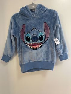 Disney Parks Unisex Kids Cute Embroidered Stitch Cozy Warm Fleece Hoodie Blue S.  Condition is new with tags.  Smoke free, pet free home.  Shipped via USPS First Class. Cute Hooded Fleece Tops, Cute Blue Fleece Hoodie, Blue Comfortable Fleece Tops, Cozy Blue Fleece Tops, Cozy Blue Fleece Top, Blue Hoodie For Loungewear, Light Blue Fleece Sweatshirt With Drawstring Hood, Blue Hoodie With Adjustable Hood For Loungewear, Cute Blue Hoodie Top