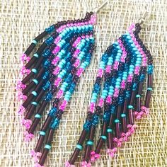 Intricately Beaded Vintage, Navajo Fringe Earrings The Handmaid Earrings Are Very Lightweight And Comfortable To Wear Brand New Condition Turquoise..Pinks.A Touch Of Teal With Iridescent Dk Plum Seed Beads These Earrings, Dangle, Beautifully, They Are About 3 Inches Total In Length And Three-Quarter Of An Inch In Width This Is A Truly Beautiful Color Combination! Hand Crafted Items Are Always Unique And Wonderful To Own! Very Much For Viewing Our Listings! Please Message Me If You Have Any Quest Southwestern Fringe Jewelry With Round Beads, Traditional Pink Beaded Earrings With Dangling Beads, Pink Beaded Fringe Jewelry For Festival, Bohemian Pink Jewelry With Dangling Beads, Artisan Pink Beaded Earrings With Dangling Beads, Purple Beaded Fringe Jewelry For Festival, Turquoise Fringe Beaded Earrings For Festival, Pink Bohemian Beaded Earrings, Pink Beaded Fringe Earrings For Festival