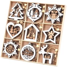 twelve wooden christmas ornaments in a box on a white background with snowflakes and stars