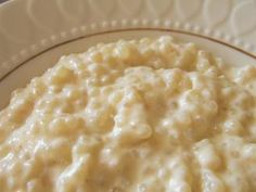 a bowl filled with oatmeal sitting on top of a table