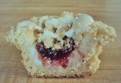 a close up of a muffin on a wooden surface