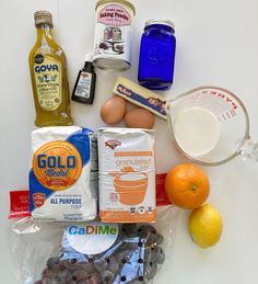 an assortment of ingredients for making blueberry muffins