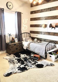 a bedroom with a cow hide rug on the floor