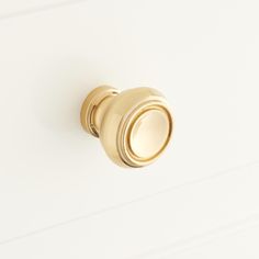 an image of a door knob on a white wall