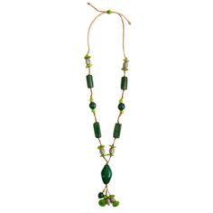 Unleash your creativity and embrace the playful spirit with the Alya Necklace. This long, adjustable necklace is a delightful fusion of unique tagua shapes, pambil, bombona seeds, and vibrant acai berries, making it the perfect accessory for retailers seeking a fun and imaginative piece that adds a burst of color and whimsy to any ensemble. Adjustable 34"-48" L Materials: Sustainable Tagua nut, Bombona seeds, Pambil, Acai Berries Faux Leather Cord Organic Vegetable dyes Handmade in Ecuador Due to the nature and size of the tagua nuts, all sizes are approximate...not exact. Colors may vary from the pictures slightly due to the nature of the Tagua Nut. Adjustable Wooden Beads Necklace In Nature-inspired Style, Adjustable Green Recycled Glass Necklace, Artisan Adjustable Recycled Glass Necklace, Casual Green Adjustable Necklace, Unique Green Fair Trade Necklace, Bohemian Adjustable Necklace With Recycled Glass, Adjustable Green Beaded Necklace With Wooden Beads, Adjustable Bohemian Necklace With Recycled Glass, Bohemian Adjustable Recycled Glass Necklace