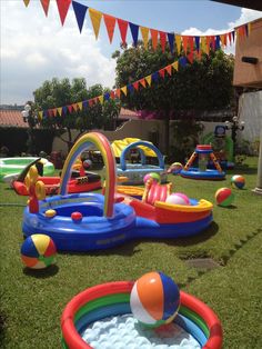 an inflatable pool and water slide set up on the lawn