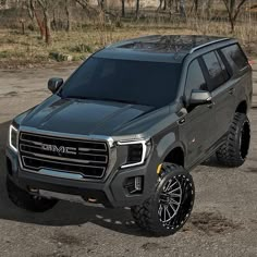 a gray truck parked in a parking lot