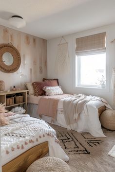 a bedroom with two twin beds and a rug on the floor in front of them