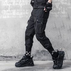 A stylish clothing that is hip hop and punk. It is fashionable, stylish, and it will look great on anyone who wears it. Do you wanahavit? Model Height: 178cm, Weight: 65kg Wear: size L Techwear Cargo Pants With Multiple Pockets For Urban Adventures, Techwear Cargo Jeans With Side Pockets, Hip Hop Cargo Jeans With Multiple Pockets For Outdoor, Urban Cargo Pants With Multiple Pockets For Streetwear, Black Cargo Jeans With Pockets For Outdoor, Techwear Streetwear Pants With Cargo Pockets, Techwear Pants With Cargo Pockets For Streetwear, Edgy Streetwear Parachute Pants With Cargo Pockets, Edgy Parachute Pants With Cargo Pockets For Streetwear