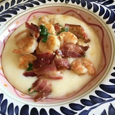 a plate with shrimp and grits on it