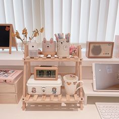 various items are arranged on a shelf in front of a window, including a clock