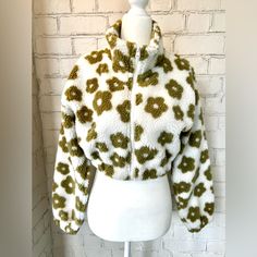 Nwot. Stay Warm And Look Stylish In This Cozy Daisy Sherpa Jacket. The Jacket Features A Collar, Drop Shoulders, Long Sleeves And A Cropped Bodice With A Zipper Closure. Perfect For Everyday Wear. True To Size. Size S - Fits Like A Size 2-4. Trendy Light Olive Green And Cream Never Worn. New Without Tags. White Cozy Outerwear For Spring, Cozy White Outerwear For Spring, Cozy White Spring Outerwear, White Fleece Jacket For Cold Spring Weather, White Fleece Jacket For Cold Weather In Spring, Cozy White Fleece Jacket For Spring, White Hooded Fleece Jacket For Spring, Light Olive Green, Retro Daisy