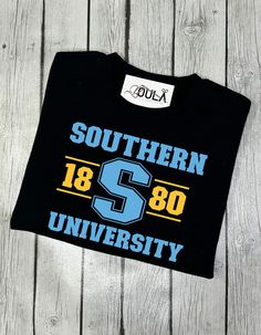 Southern University shirt, Southern jaguars, Homecoming shirt, Game day shirt, Go jaguars, Southern University College, HBCU Made from Gildan 100% cotton unisex shirt. Available in sizes from Small to 3XL to ensure a perfect fit for everyone. **Please Note** Due to the nature of our products, we do not accept returns or exchanges. Please check your size carefully before placing your order. *If you have any questions please feel free to message me. Black College T-shirt With School Spirit, Hbcu Fits, Langston University Shirts, Southern University Jaguars Shirts, Jsu Jackson State University Shirt, College Homecoming, College Hbcu, Texas Southern University Shirts, Southern University