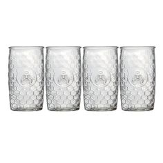 four glasses are lined up in a row