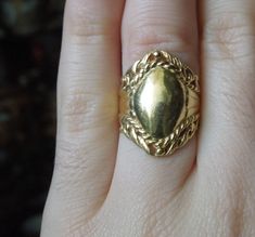 "Vintage Mid-Century Circa 1960 Constructed of Sterling Silver Accented with a Gold Plating Top section of ring measuring approximately 1\" in length --Refer to photo on finger in natural daylight-- Inside shank: 925 Finger Size 6 (Sizing upon request; Additional fees may apply) Weighing 5.9 grams *Sale of ring includes an appraisal certificate for your insurance purposes. All pieces shipped insured via USPS Priority Mail requiring signature upon delivery. Specialty gift wrap upon request at no Vintage Gold Engraved Ring, Vintage Ceremonial Jewelry Metal Ring, Vintage Ceremonial Metal Ring Jewelry, Vintage Jewelry With Ring Detail For Formal Occasions, Vintage Formal Jewelry With Ring Detail, Vintage Oval Jewelry With Ring Detail, Vintage Ceremonial Rings With Polished Finish, Signet Rings, Bezel Ring