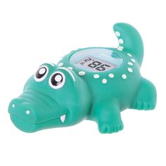 an alarm clock shaped like a crocodile