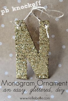 the letter n is made out of gold glitter