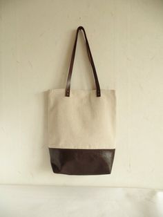 Vegan leather and natural linen colorblock carry all tote bag with real leather handles. *Exterior: - Bottom - high quality vegan leather in dark chocolate brown - Top - organic natural linen in oatmeal color * Interior - Fully lined with light gray and white victorian print floral pattern natural cotton - Two interior slip pockets * Brown real leather handles reinforced with two silver toned brass rivets each. Very stylish every day carry all large tote which will give a classy look to your dai Color Block Tote Bag, Linen Tote Bag, Color Block Tote, White Victorian, Casual Tote Bag, Leather And Canvas, Casual Tote, Tote Bag Leather, Large Tote Bag