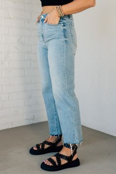 Introducing our Charlie Crop Hem Jeans, featuring a high rise and wide leg in the trendy light wash. This denim boasts subtle fading and whiskering, along with a unique raw cut frayed hem. Complete with a five pocket design and easy zip fly button closure. Rock the denim game with these quirky, playful jeans! 99% Cotton 1% Spandex High Rise Light Wash Straight leg Relaxed Fit Wide Leg No distressing SIZE GUIDE & MEASUREMENTS: Model is 5'4" wears a size 3/5 and modeling the size 3. More info here Jean Romper, Hair Socks, Poncho Tops, Hem Jeans, Jumpsuit Shorts Rompers, Short Jumpsuit, Knee Length Dresses, Lounge Pants, Limited Stock