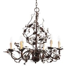 a chandelier with five candles hanging from it's center and leaves on the bottom