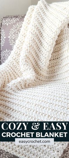 a crocheted blanket sitting on top of a couch with the text cozy and easy crochet blanket