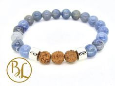 "Blue Aventurine Rudraksha 925 Sterling Silver Bracelet Third Eye Chakra Bracelet Blue Aventurine Yoga & Meditation Bracelet Rudraska Seed This 100% Natural Blue Aventurine Gemstone Bracelet is made with The Bodhi Lotus 925 Sterling Silver Charm 8mm Blue Aventurine Gemstones and Bodhi Tree Seed or Rudraska Seed The Bodhi Lotus handmakes all their creations with intention. All the gemstones and crystals have been cleansed. The handcrafted piece is then smudged and charged with crystals so it' Spiritual Sterling Silver Bracelet With Natural Stones For Healing, Adjustable Aventurine Gemstone Bracelets, Silver Aventurine Bracelet Jewelry, Spiritual Blue Sterling Silver Bracelet With Gemstone, Blue Sterling Silver Spiritual Bracelet With Gemstones, Adjustable Aventurine Gemstone Bracelet, Silver Aventurine Bracelet, Spiritual Blue Adjustable Sterling Silver Bracelet, Silver Lapis Lazuli Beaded Bracelets For Healing