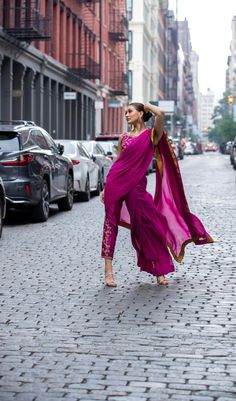 Look bold and elegant in this fusion of Saree Pants adorned with handworked zardozi, resham, dabka, sequins and mukesh to create a perfect symphony! Bright Magenta colored pure chiffon Saree, with a rawsilk blouse and cigarette pants. Bold Saree Photoshoot, Pants Saree, Saree Pants, Magenta Pants, Pant Saree, Pure Chiffon Sarees, Astoria Ny, Saree Photoshoot, Pure Chiffon