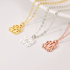 "Dainty Monogram Necklace A monogram pendant is created by using a combination of 3 initials to form a unique symbol tailored to an individual. The monogram is laser cut from a uniform sheet of metal in the initials of your choice.  DETAIL * Material: 925 Sterling Silver / Copper * Color: 100% Silver, Gold, Rose Gold * Chain Type: Cable Chain * Pendant: 10 mm * Chain Length: 14\", 16\", 18\", 20\", 22\" PRODUCTION TIME * All our products are made to order so please allow us to take 6-14 business days to finish your jewelry before shipping out. SHIPPING TIME * UK orders: 3 - 5 business days with standard shipping. It subjects to be longer in holiday season. * Other countries: please check delivery date at check-out, or contact us if you need by a sooner date. MATERIAL * You can choose from White Initial Pendant Necklace With Monogram, White Monogram Initial Pendant Necklace, White Monogram Initial Necklace, White Initial Pendant Necklace, White Monogram Initial Pendant Jewelry, White Initial Pendant Name Necklace, White Initials Pendant Charm Necklace, Silver Monogram Charm Necklace For Mother's Day, Personalized Silver Monogram Charm Necklace